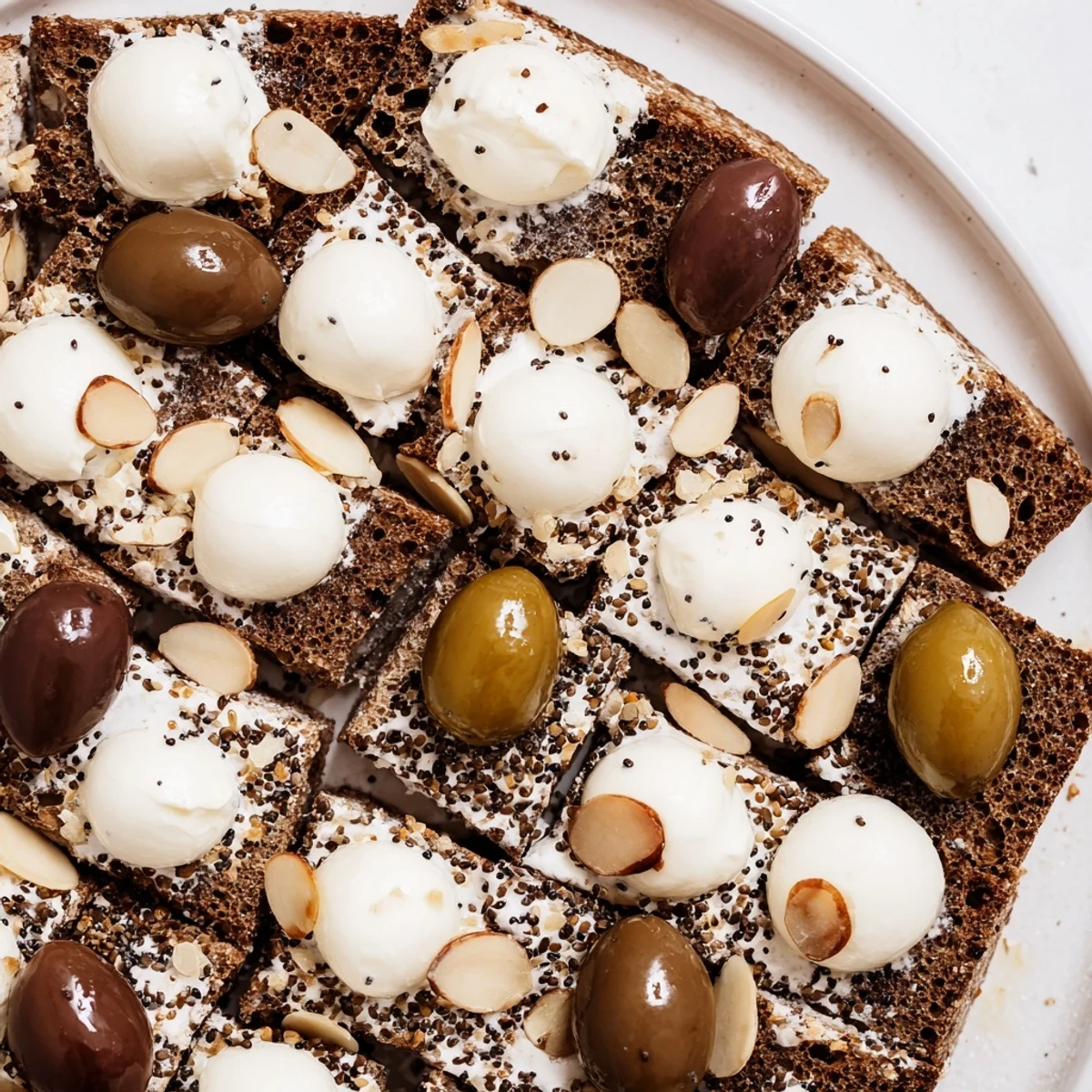 Appetizing Black and White Formal Affair appetizer, featuring olives and mozzarella artfully arranged on a platter.