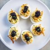 Elegant appetizer: creamy deviled eggs topped with glistening caviar and crunchy shallots, delicious!