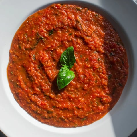 Steaming Hidden Veggie Tomato Pasta Sauce with vibrant colors, served hot over a bed of gluten-free pasta.