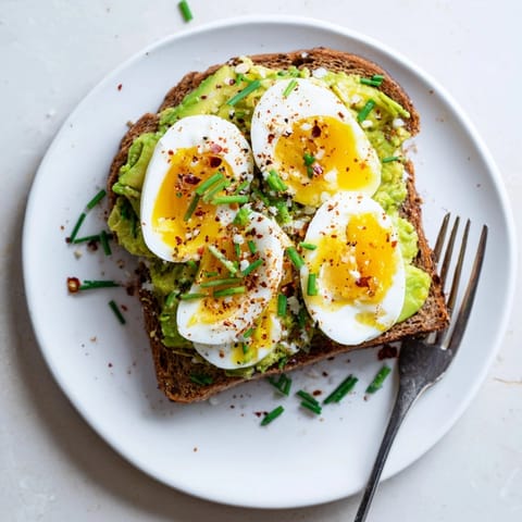 Creamy Hard-Boiled Egg Avocado Toast, seasoned and served atop perfectly golden whole-wheat toast.