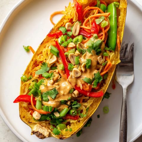 Creamy, vibrant Thai Peanut Spaghetti Squash Boats; a healthy and delicious gluten-free meal.
