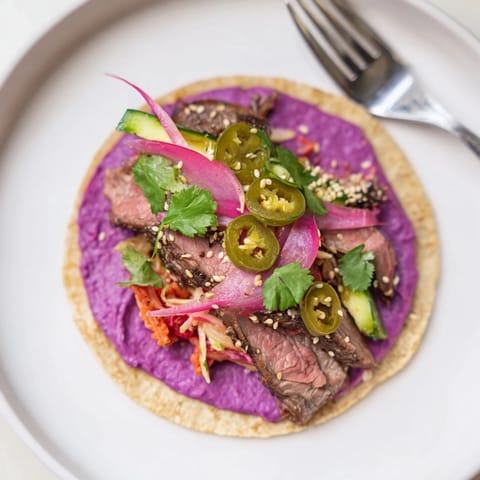 Colorful bowls of Global Street-Food Fusion Tacos featuring fresh toppings and savory protein.  