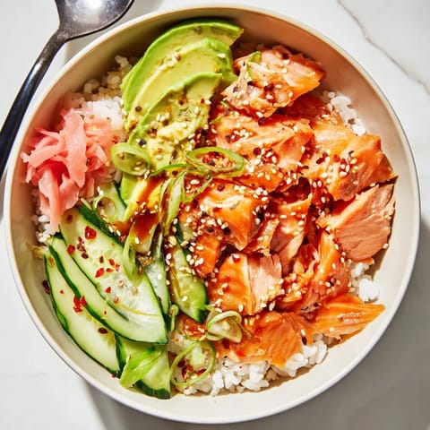 Quick and easy leftover salmon and rice bowl served with tangy pickled ginger.  