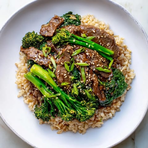 A beautiful photo of savory Slow-Cooker Beef & Broccoli, ready to be served over rice, a complete meal.