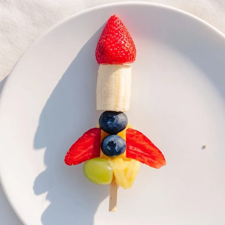 Kid-friendly Rocket Ship Fruit Skewers are bursting with fresh fruit and perfect for a fun party.