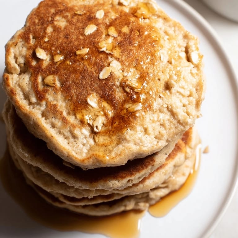 Overhead shot of fluffy banana oat pancakes, perfect for a quick and healthy breakfast in the U.S.