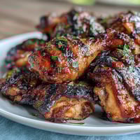 Honey Garlic Grilled Chicken Thighs with sticky-sweet glaze and golden charred edges, served on a rustic wooden platter. Juicy honey garlic chicken thighs sizzling on the grill, brushed with a glossy marinade for a caramelized finish. Plump chicken thighs marinated in honey garlic sauce, grilled until smoky and tender, perfect for summer cookouts.